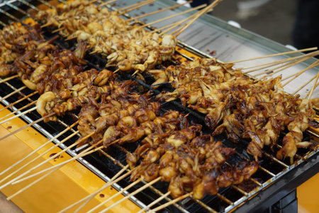 Mushroom satay on the grilled process. Sate is one of the famous Indonesian food