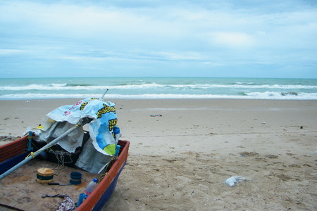 Boats on the beach, by the sea.の写真素材