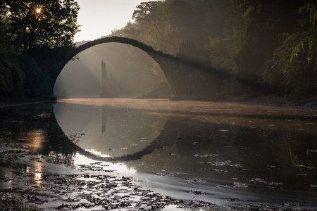 Rakotz bridge - The Devils Bridge as built in 1860. Because of the unique construction accuracy, the bridge and its reflection merge into a perfect circleの写真素材