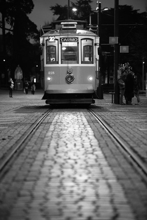 PORTO, PORTUGAL - FEBRUARY 09: Historical tram on a tram station with people going to get on in Porto, Portugal, on February 09, 2016のeditorial素材