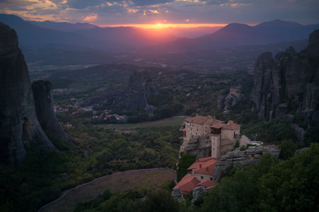 Evening view on the Meteora vally with the Rousanou, the St. Nicholas Anapausas and Grand Meteora...