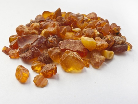 handful of amber on white backgroundの写真素材