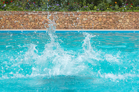 Close view of the water splashes in the swimming poolの写真素材