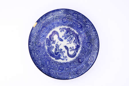 Kintsugi pottery. Gold cracks restoration on old Japanese pottery restored with the antique Kintsugi restoration technique. The beauty of imperfections.の写真素材