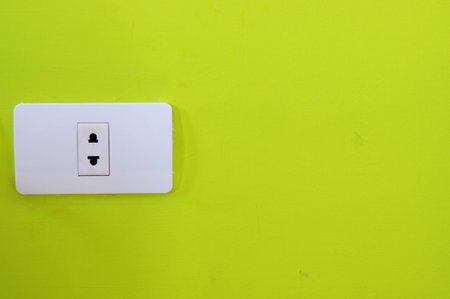  North American white electric wall outlet receptacle green