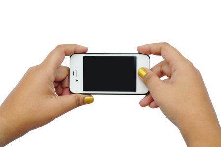 female teen hand taking photo with generic smartphone, isolated on whiteの写真素材