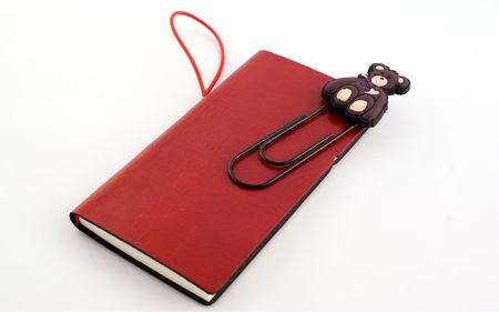 Red notebook with clipの写真素材