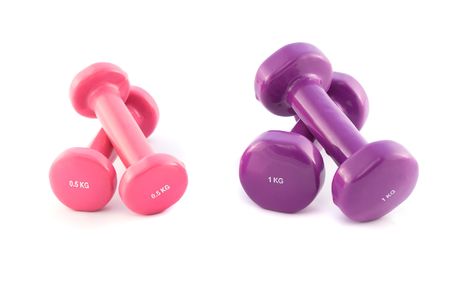 Violet and pink dumbbells on white backgroundの写真素材
