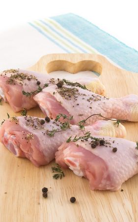 Chicken breast meat on chopping boardの写真素材