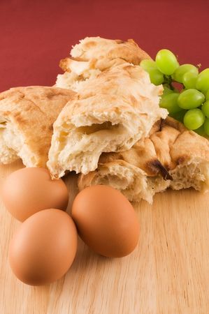 Fresh pita bread with eggs  and grapesの写真素材