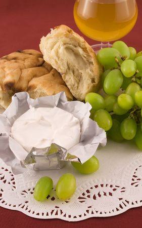 Fresh  pita bread with grapes and cheese with white moldの写真素材