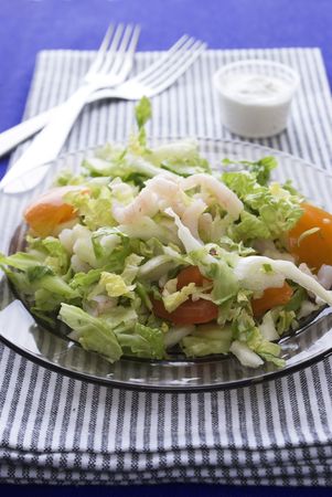 Fresh salad with shrimp and tomato on plateの写真素材