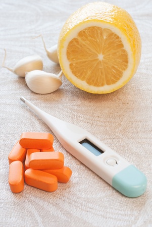 thermometer with garlic, lemon and  pillの写真素材