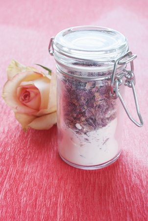Dried rose petals in a jar with roseの写真素材