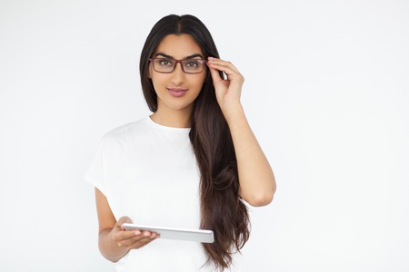 Confident Beautiful Indian Woman Holding Tabletの写真素材