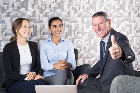 Lawyer Giving Consultation to Two Young Womenの写真素材