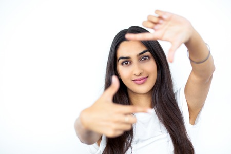 Content Pretty Indian Woman Making Frame Gestureの写真素材
