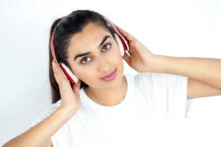 Content Woman in Headphones Listening to Musicの写真素材