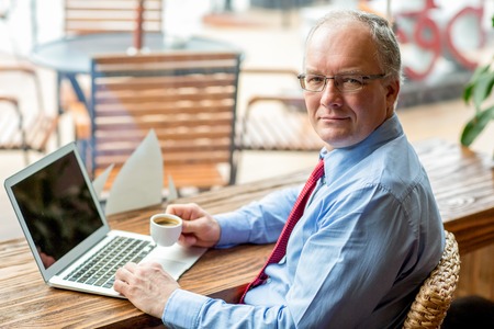 Content Business Man Working in Cafe with Coffeeの写真素材