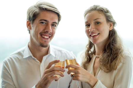 Portrait of happy couple with champagne flutesの写真素材