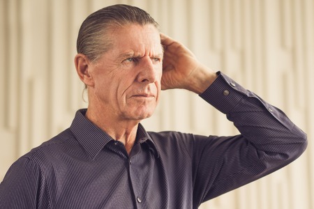 Thoughtful Frown Serious Senior Man Looking Awayの写真素材