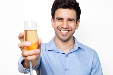 Portrait of happy man toasting with fluteの写真素材