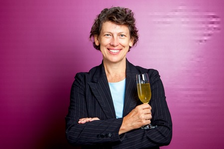 Smiling senior businesswoman with champagne fluteの写真素材