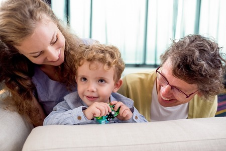 Happy Granny and Mommy Playing With Little Boyの写真素材