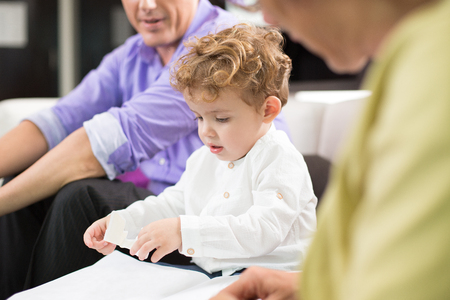 Little Kid Playing With Family at Home