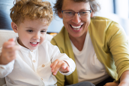 Smiling Grandmother Playing With Excited Grandsonの写真素材