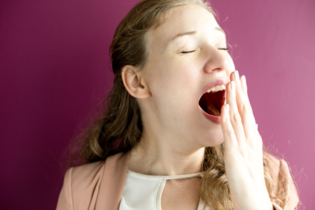 Closeup of Sleepy Pretty Woman Yawning