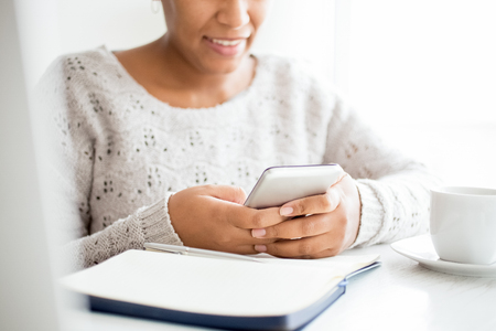 Close-up of businesswoman using smartphoneの写真素材