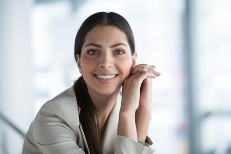 Charming Business Lady With Hands Clasped