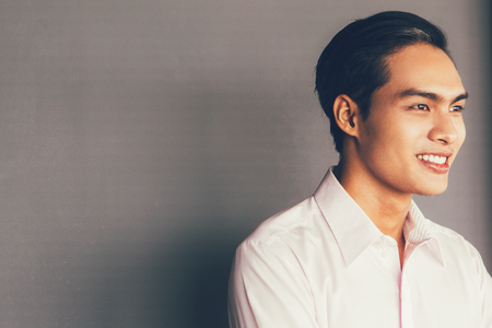 Portrait of Smiling Young Asian Businessmanの写真素材