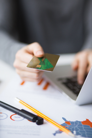 Cropped View of Person Doing Online Bankingの写真素材