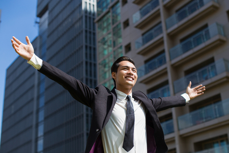Joyful Manager Celebrating Success Outsideの写真素材