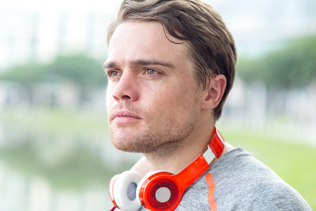 Closeup of Pensive Sporty Man With Headphonesの写真素材