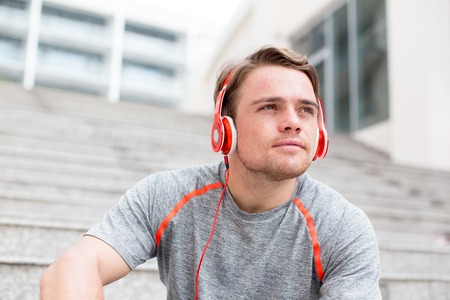 Content Sportsman Listening to Music on Stairsの写真素材