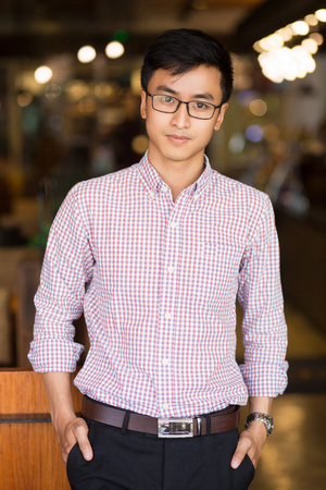 Portrait of confident young Asian businessmanの写真素材