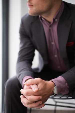 Confident young businessman waiting for interviewの写真素材