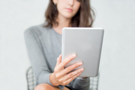 Close-up of businesswoman using tablet