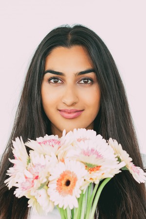 Smiling young woman with beautiful bouquetの写真素材