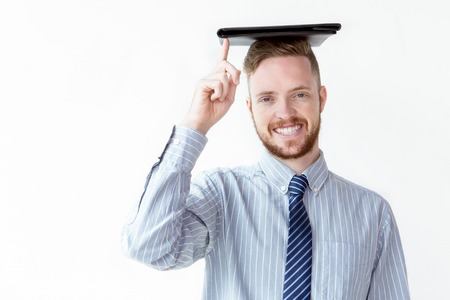 Cheerful businessman with leather folder on headの写真素材