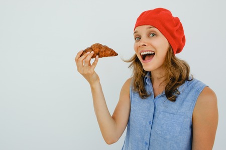 Joyful Woman Going to Eat Delicious Croissantの写真素材