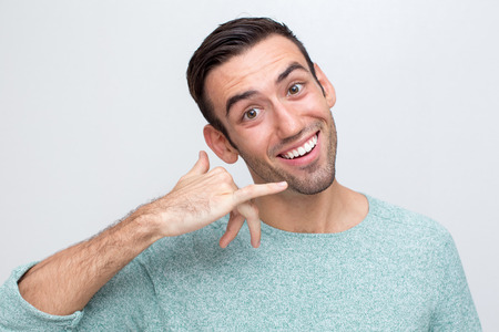 Closeup of Friendly Man Making Call me Gestureの写真素材