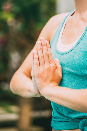 Close-up of serene woman beginning yoga classの写真素材