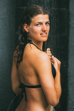 Closeup of Pretty Woman Having Outdoor Showerの写真素材