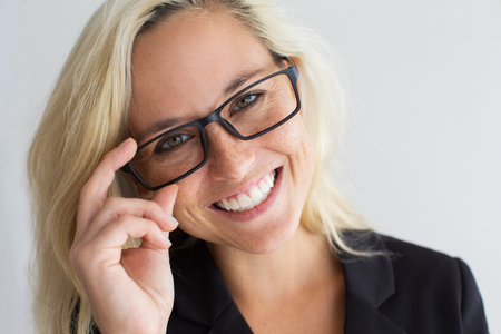 Close-up of cheerful young woman wearing glassesの写真素材