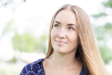 Dreamy young woman thinking of loveの写真素材