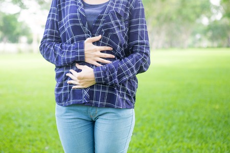 Pregnant woman embracing her belly